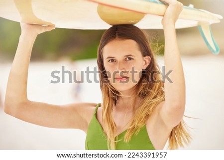 Woman, portrait and surfer with surfboard at beach, travel and fitness with adventure, exercise and ready to surf in Hawaii. Young girl on holiday, workout and nature with extreme sport and wellness.