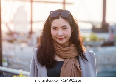 Woman Portrait Young Thai Women Shopping In The Evening, Lifestyle For Woman Walk In Riverside Sunset, Candid Portrait Woman Bangkok, Thailand, Asia.