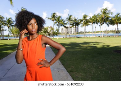 Woman Posing In A Retro Orange Jump Suit