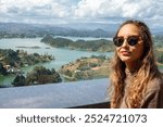 Woman Posing with Scenic Guatape Colombia Landscape