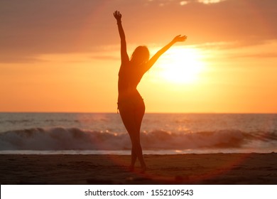 woman with a positive attitude in front of the sea - Powered by Shutterstock