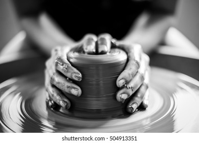 Woman Potter Hands Makes On The Pottery Wheel Clay Pot , Black And White 