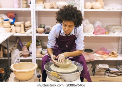 Woman Pottery Artist At Workshop Molding Clay On Pottery Wheel At Ceramic Studio - Powered by Shutterstock