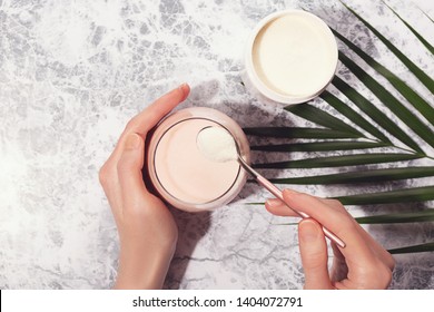 Woman Pour Collagen Powder Or Protein In Morning Smoothie Or Yogurt. Natural Beauty And Health Supplement. Healthy Lifestyle. Flatlay, Top View. Copy Space.