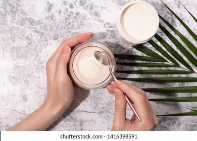 Woman Pour Collagen Powder Or Protein In Morning Smoothie Or Yogurt. Natural Beauty And Health Supplement. Healthy Lifestyle. Flatlay, Top View. Copy Space.