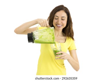 Woman pouring green smoothie into a glass - Powered by Shutterstock