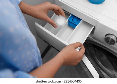 Woman Pouring Laundry Detergent Into Drawer Of Washing Machine Indoors, Above View