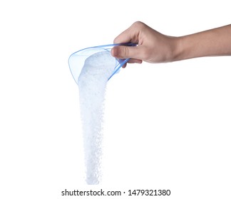 Woman pouring laundry detergent from measuring container against white background, closeup - Shutterstock ID 1479321380