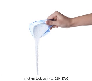 Woman pouring laundry detergent from measuring container against white background, closeup - Shutterstock ID 1482041765