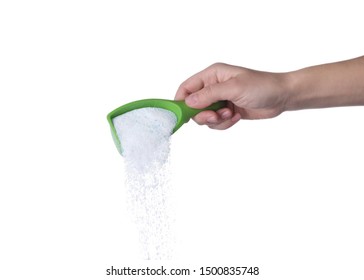 Woman pouring laundry detergent from measuring container against white background, closeup - Shutterstock ID 1500835748