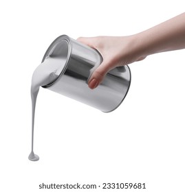 Woman pouring paint from can on white background, closeup