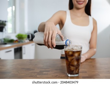 Woman Pouring Soda To Glass For A Refreshing Drink