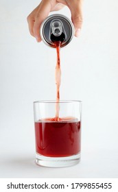 Woman Pouring Sweet Flavoring Soda Drink Into The Glass, White Background