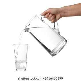 Woman pouring water from jug into glass on white background, closeup - Powered by Shutterstock