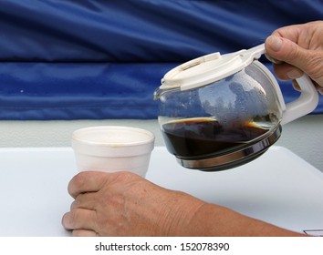 woman pours a mourning cup of coffee