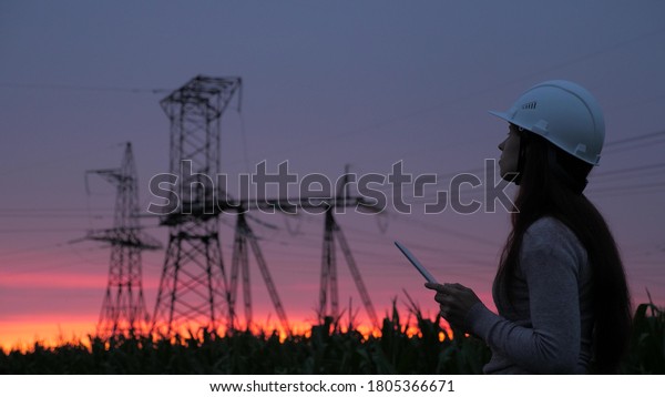 Стоковая фотография 1805366671: Woman Power Engineer White Helmet