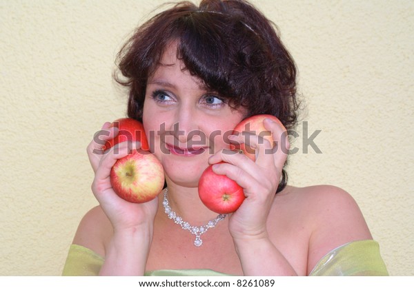 Woman power in the hands\
of 4 apples.
