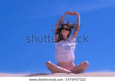 Similar – Image, Stock Photo Tattooed woman in front of a painted wall