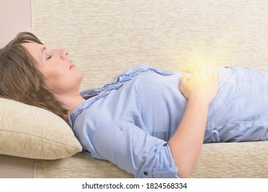 Woman Practicing Self Reiki Transfering Energy Through Palms, A Kind Of Energy Medicine.