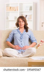 Woman Practicing Self Reiki Transfering Energy Through Palms, A Kind Of Energy Medicine.