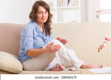 Woman Practicing Self Reiki Transfering Energy Through Palms, A Kind Of Energy Medicine.