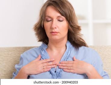 Woman Practicing Self Reiki Transfering Energy Through Palms, A Kind Of Energy Medicine.