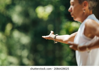 Woman Practicing Tai Chi Chuan Outdoors. Close Up On Hand Position