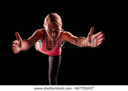 Similar – Close up side view profile portrait of one young athletic woman shadow boxing in sportswear in gym over dark background, looking away