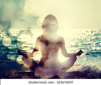 Woman Practicing Yoga by the Sea. Rear View. Double Exposure Filtered Photo with Bokeh. Soul Concept.