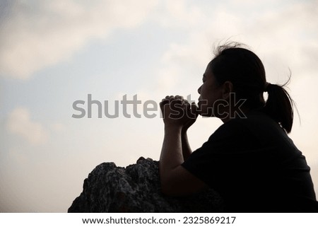 Woman praying to god, posing asian women, girl adult fashionable model, feeling moments, enjoying, happiness on top mountain. Female christian worshipper.