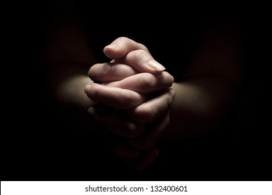 Woman Praying With Hands Folded To God.