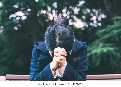 Woman Praying At Outside