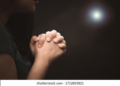 woman praying and worship to GOD Using hands to pray in religious beliefs and worship christian in the church or in general locations in vintage color tone or copy space.