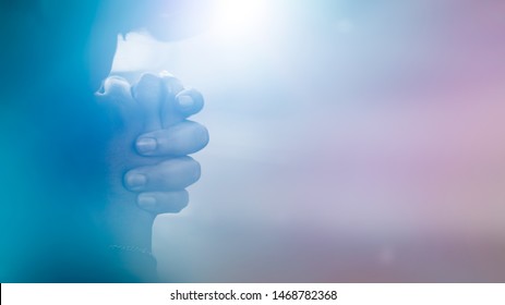 Woman praying worship at home.Teenager woman hand praying,Hands folded in prayer.Thanksgiving, Give thank, forgiveness.Concept for faith, spirituality, fasting religion,Pentecost day.believe hope