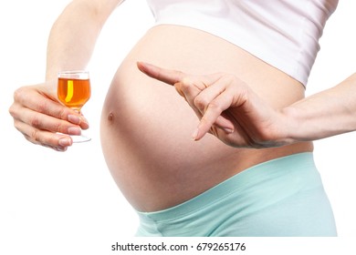 Woman in pregnant with glass of wine, concept of unhealthy lifestyles during pregnancy and motherhood
