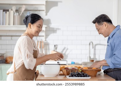 A woman prepares fresh vegetables in a cozy kitchen, while a man assists in the background. The scene emphasizes a warm and healthy lifestyle with a focus on fresh produce and home cooking. - Powered by Shutterstock