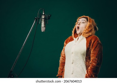 Woman prepares herself and a material before voice recording. Soundproof room for professional recording vocal. Voice artist works with material before dubbing or voice over process
