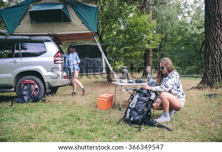 Similar – Image, Stock Photo Young women looking road map with vehicle on background