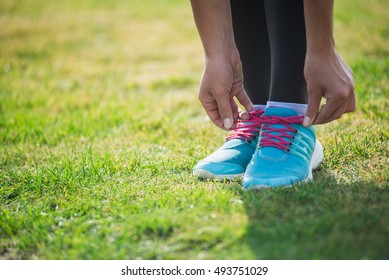 Woman Preparing Before Run Putting On Running Shoes