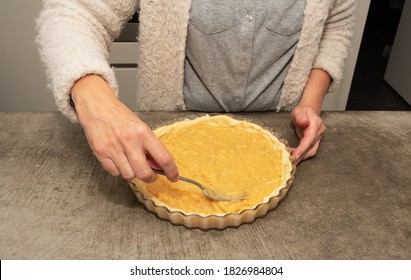 Woman Preparing A Cake On A Concrete Work Top