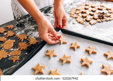 Woman preparing Christmas cookies at home Stock Photo