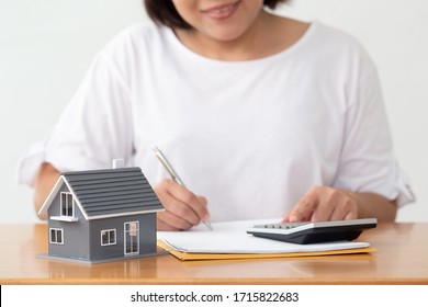 Woman preparing documents file for loan home and refinance - Shutterstock ID 1715822683