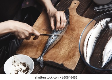 Woman Preparing Mackerel Fish