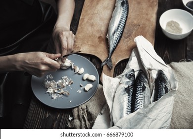 Woman Preparing Mackerel Fish