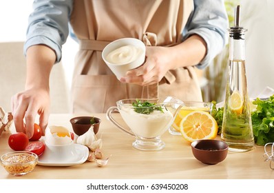 Woman Preparing Mayonnaise In Kitchen