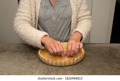 Woman Preparing A Pear Cake On A Concrete Work Top