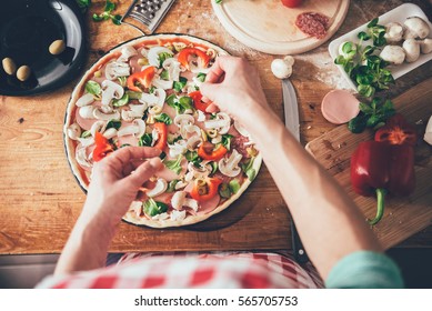 Woman Preparing Pizza In The Kitchen