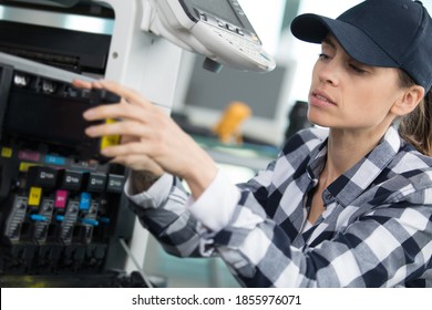 Woman Preparing Printer In Shop