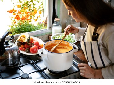 Woman preparing a pumpkin soup Stock Photo