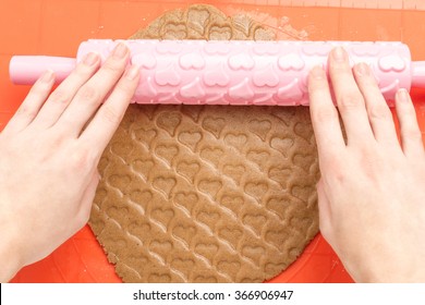 Woman Preparing Sweet Heart Shaped Dough. Hands Rolling Dough For Cookies. View From Above